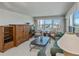 Bright living room with ocean view, wood furnishings, and comfortable seating at 627 Alhambra Rd # 601, Venice, FL 34285