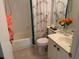 Bright bathroom featuring floral shower curtain and sink vanity with ample counter space at 634 Bird Bay E Dr # 103, Venice, FL 34285