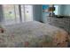 The bedroom features a large bed and dresser with decorative items at 634 Bird Bay E Dr # 103, Venice, FL 34285