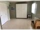 A bright bedroom with ample closet space and light tile floor at 634 Bird Bay E Dr # 103, Venice, FL 34285