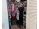 Walk in closet with ample storage and shelving at 634 Bird Bay E Dr # 103, Venice, FL 34285