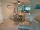 The dining room features tile floors and seating for four at 634 Bird Bay E Dr # 103, Venice, FL 34285