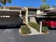 Condo exterior featuring assigned covered parking and a landscaped walkway to the front entrance at 634 Bird Bay E Dr # 103, Venice, FL 34285