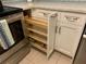 Kitchen cabinets with convenient pull out wooden shelving at 634 Bird Bay E Dr # 103, Venice, FL 34285