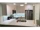Renovated kitchen with stainless steel appliances, granite countertops, and ample storage at 634 Bird Bay E Dr # 103, Venice, FL 34285