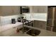Renovated kitchen with stainless steel appliances, granite countertops, and ample storage at 634 Bird Bay E Dr # 103, Venice, FL 34285