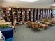 The library features bookshelves and comfortable chairs, a quiet place for reading and relaxation at 634 Bird Bay E Dr # 103, Venice, FL 34285