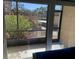 A screened in lanai that has room to sit and relax and enjoy the beautiful landscaping at 634 Bird Bay E Dr # 103, Venice, FL 34285