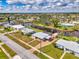 Expansive aerial shot showing a waterfront community with canal access, showcasing a charming single-story home at 6627 Marius Rd, North Port, FL 34287