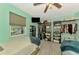 Shared bedroom with two beds, light gray flooring, and closet organizing system at 6627 Marius Rd, North Port, FL 34287