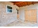 View of a covered carport area with double doors and an adjacent exterior door at 6627 Marius Rd, North Port, FL 34287