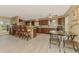 Spacious kitchen features stainless appliances, a breakfast bar with seating and an adjacent dining area at 6627 Marius Rd, North Port, FL 34287