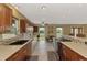 Gourmet kitchen featuring stainless steel appliances, custom cabinetry, and a stylish backsplash at 6627 Marius Rd, North Port, FL 34287