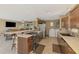 This open-concept kitchen features a breakfast bar, modern appliances, and seamless access to the living area at 6627 Marius Rd, North Port, FL 34287
