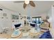 Dining area with glass table, seating for four, and view of the living room at 110 Vista Hermosa Cir # 102B, Sarasota, FL 34242