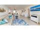Comfortable living room with views into the dining area; TV for entertainment at 110 Vista Hermosa Cir # 102B, Sarasota, FL 34242