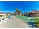 Shuffleboard courts with palm trees and a blue sky, promoting an active lifestyle at 110 Vista Hermosa Cir # 102B, Sarasota, FL 34242