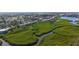 Scenic aerial view showcasing the condo community with stunning water and mangrove views at 1106 Bird Bay Way # 316, Venice, FL 34285