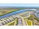 Picturesque aerial view featuring homes along a waterway and ponds, showcasing a community with boating access and natural beauty at 14724 Ponce De Leon Trl, Port Charlotte, FL 33981