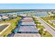 Stunning aerial view shows homes with beautiful backyards, pools, and picturesque lakes creating a serene environment at 14724 Ponce De Leon Trl, Port Charlotte, FL 33981