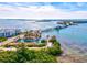 Scenic aerial view of waterfront property featuring a bridge, marina, and beautiful coastal landscape at 14724 Ponce De Leon Trl, Port Charlotte, FL 33981