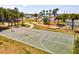 Well-maintained outdoor basketball court with playground, providing ample space for sports and recreational activities at 14724 Ponce De Leon Trl, Port Charlotte, FL 33981