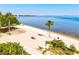 Beautiful beach with calm waters, ideal for relaxing, sunbathing, and enjoying a peaceful day by the sea at 14724 Ponce De Leon Trl, Port Charlotte, FL 33981