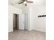 Bright bedroom with tile flooring, a ceiling fan, a closet, and fresh white walls at 14724 Ponce De Leon Trl, Port Charlotte, FL 33981