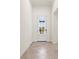 Inviting foyer with tile flooring and view to the front door at 14724 Ponce De Leon Trl, Port Charlotte, FL 33981