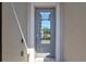 Elegant front door with glass panel allowing ample natural light at 14724 Ponce De Leon Trl, Port Charlotte, FL 33981