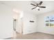 Bright living room features neutral paint, tile floors, and a window with stylish shutters at 14724 Ponce De Leon Trl, Port Charlotte, FL 33981
