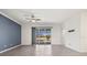 Spacious living room with a view of the pool area and the community through a large sliding glass door at 14724 Ponce De Leon Trl, Port Charlotte, FL 33981