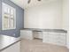 Home office featuring built-in cabinetry with plenty of storage space and a window with shutters at 14724 Ponce De Leon Trl, Port Charlotte, FL 33981