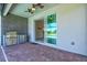 Patio featuring a built-in grill station and views of the swimming pool through sliding glass doors at 14724 Ponce De Leon Trl, Port Charlotte, FL 33981