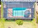 Aerial view of a screened in pool, offering a private retreat for relaxation and recreation at 14724 Ponce De Leon Trl, Port Charlotte, FL 33981