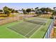 Outdoor tennis court next to playground and basketball court, encouraging an active lifestyle and outdoor enjoyment at 14724 Ponce De Leon Trl, Port Charlotte, FL 33981