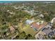Neighborhood homes nestled among lush green trees and landscaping at 1611 Thomas St, Englewood, FL 34223