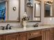 Granite countertop and dual sinks enhance this classic bathroom's functionality and style at 1611 Thomas St, Englewood, FL 34223