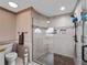 Contemporary bathroom with a glass-enclosed shower and modern fixtures at 1611 Thomas St, Englewood, FL 34223