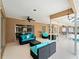 Wide view of screened-in patio with outdoor furniture and view of pool and fenced backyard at 1611 Thomas St, Englewood, FL 34223