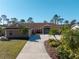 Beautiful single story home with mature landscaping and a long private driveway at 1611 Thomas St, Englewood, FL 34223