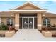 Inviting front entrance featuring decorative screen doors and charming exterior lighting at 1611 Thomas St, Englewood, FL 34223