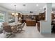 Spacious eat-in kitchen features wood cabinetry, island, and plenty of room for a dining set at 1611 Thomas St, Englewood, FL 34223