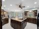 Spacious kitchen featuring a large island, granite counters, and stainless steel appliances at 1611 Thomas St, Englewood, FL 34223
