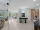 Living area showcasing pool access, tile floors, and an open floor plan at 1611 Thomas St, Englewood, FL 34223