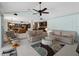 Open living room flows into kitchen, featuring vaulted ceilings and comfortable seating at 1611 Thomas St, Englewood, FL 34223