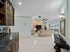 Open concept living area with a bar, tile flooring, and a view to the living room at 1611 Thomas St, Englewood, FL 34223