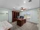 Office space with built-in bookshelves, a large wooden desk, carpet flooring and large window at 1611 Thomas St, Englewood, FL 34223