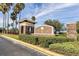 Beautiful community sign with palm trees and lush landscaping with stone architecture at 1724 Bonita Bluff Ct, Ruskin, FL 33570