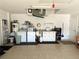 Functional laundry area inside the garage featuring a washer, dryer, and utility sink at 4091 Pomeroy St, North Port, FL 34291